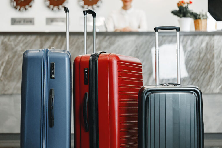 Luggage suitcase for trips standing in hotel lobby close up